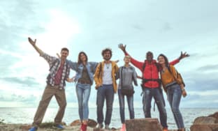 a group of friends smiling after a hike